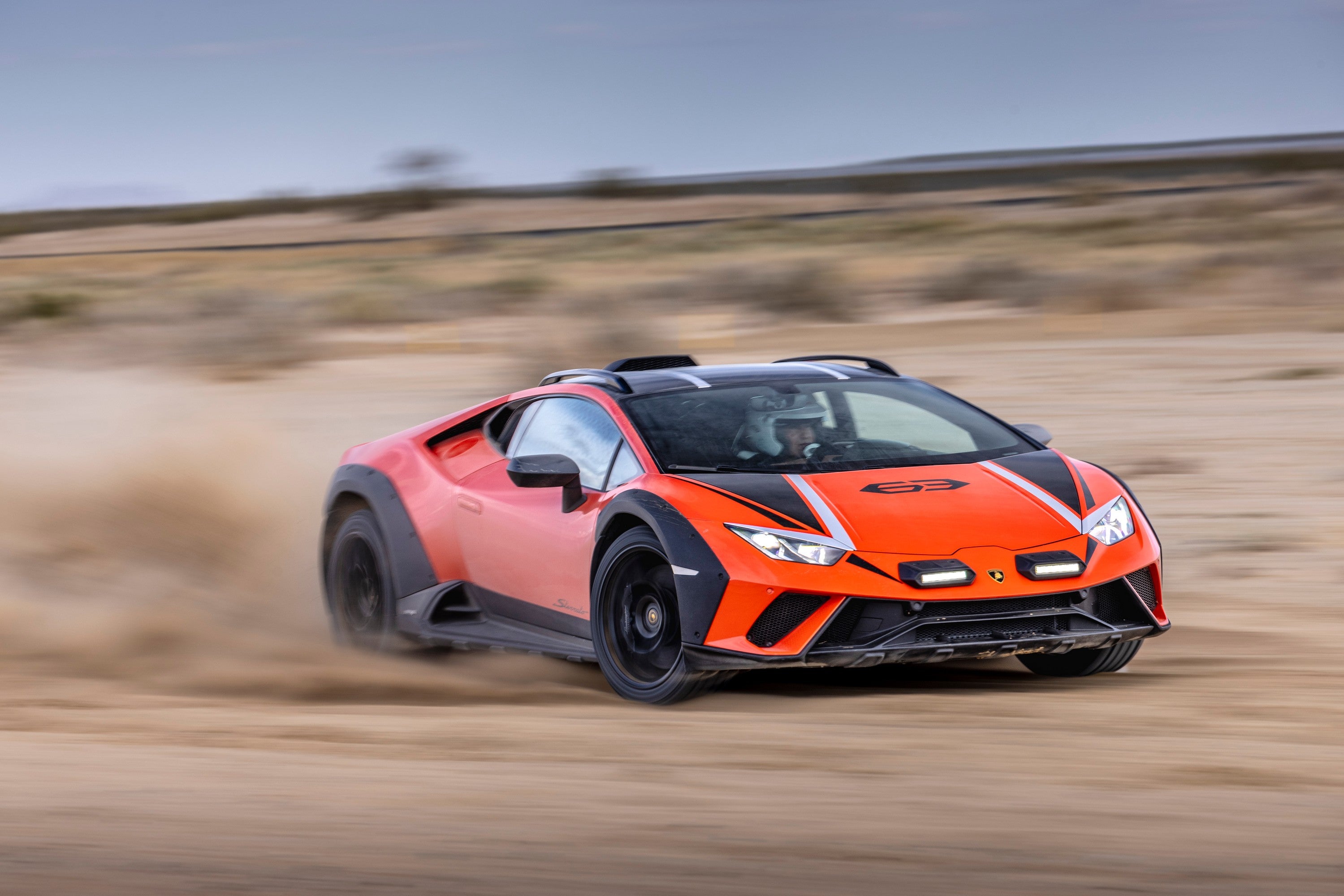 The 2024 Lamborghini Huracan Sterato glides sideways through the desert.