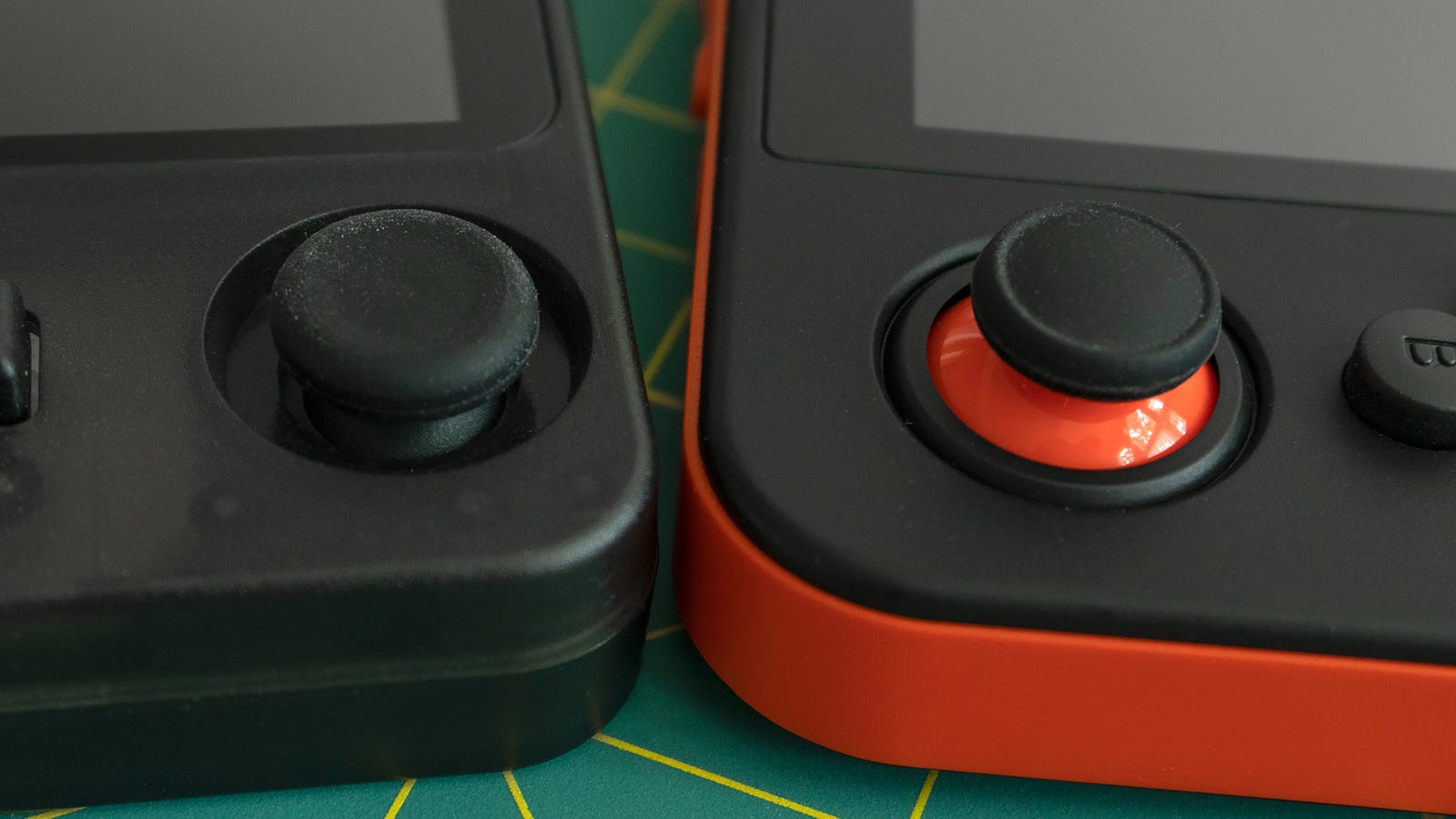 The recessed analog joystick on the RK2020 (left) makes the handheld easier to pocket, and it has less travel and is slightly looser than the joysticks on the RG350 (right), which I prefer. However, you only get one.