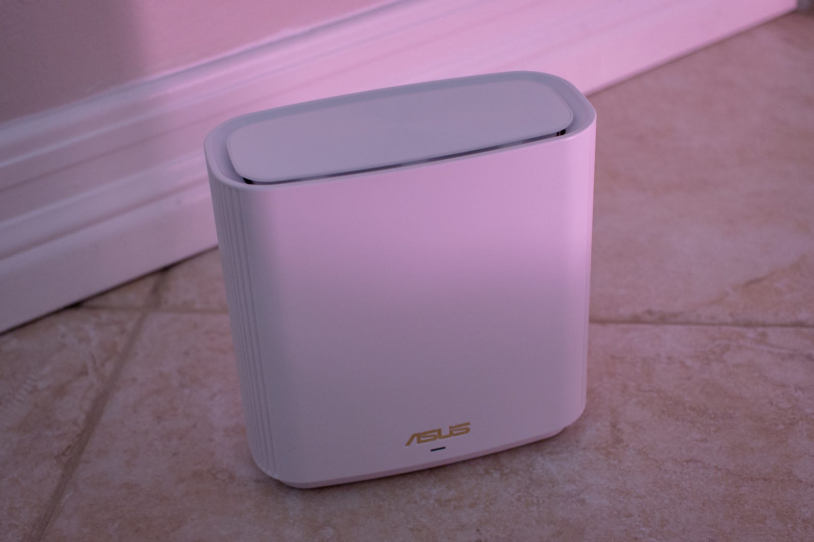 The Asus ZenWiFi AX6600 XT8 is quite fine. I can probably blend it into a backdrop.