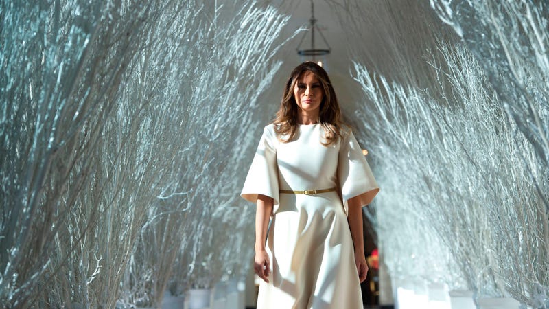 Former First Lady Melania Trump walks through the East Wing of the White House, which she decorated, during Christmas in 2017.