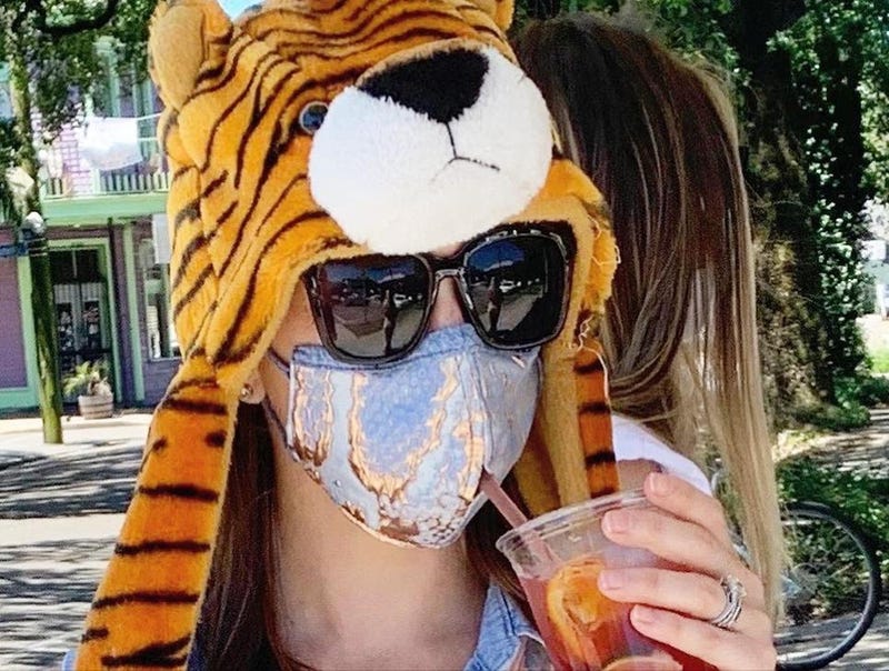 White Woman Makes Face Masks With Mouth Hole For Drinking