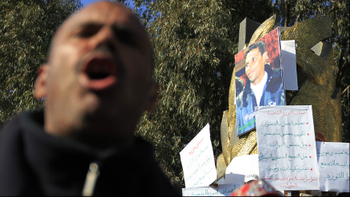 Tunisians protest near a government building where Mohamed Bouazizi set himself alight in Sidi Bouzid January 19,2011.