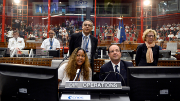 French President Francois Hollande sits in the &#039;Jupiter&#039; operations manager room at the Kourou space centre (CSG), French Guiana, Saturday, Dec. 14, 2013. Hollande made his first trip overseas as French President to Guyana, after having recently approved two newly signed agreements, one which aims to fight illegal gold mining and another which hopes to promote better vocational training nationwide. Others are unidentified.