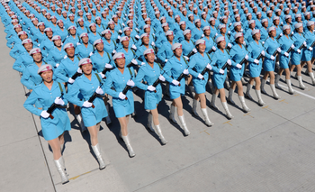 Female members of Chinese militia march in formation during a training session for the 60th National Day Parade Village on the outskirts of Beijing
