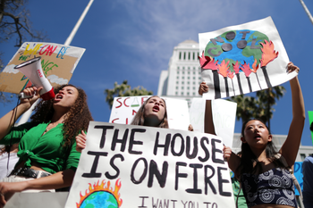 Students attend a protest rally to call for urgent action to slow the pace of climate change, in Los Angeles, California