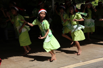 A group of children dance in a performance organzied by a local church to raise money after Typhoon Bopha on the island of Bohol in the Philippines.