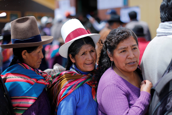 Women wait in line to vote during Peruvian municipal and regional elections in Cuzco