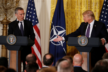 U.S. President Donald Trump (R) and NATO Secretary General Jens Stoltenberg