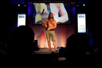 Chase Ferrel with Urban Carry Holsters displays a concealed hip holster during the National Rifle Association (NRA) Carry Guard Expo Fashion Show in Milwaukee, Wisconsin, U.S., August 25, 2017. REUTERS/Ben Brewer - RTX3DDLY