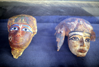 epa06378800 Painted wooden masks on display at a recently found tomb and re-discovery of older one, at Draa Abul Naga necropolis on Luxor?s west bank, 700km south of Cairo, Egypt, 09 December 2017. Egypt&#039;s Ministry of Antiquities announced the discovery of a tomb from the New Kingdom that belongs to the old Egyptian deity Amun&#039;s Goldsmith, Amenemhat (tomb number Kampp 390) and a burial shaft housing the mummy of a lady and her two children. The newly discovered tomb includes an entrance located in the courtyard of another Middle Kingdom tomb number Kampp 150. EPA-EFE/KHALED ELFIQI