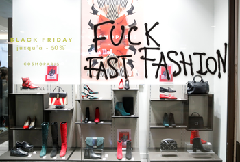 The slogan &quot;Fuck Fast Fashion&quot; is seen on a shop window as Youth for Climate activists demonstrate inside the Westfield Les 4 Temps shopping center as part of a day of protest to denounce the annual Black Friday shopping frenzy at La Defense business and financial district in Puteaux near Paris
