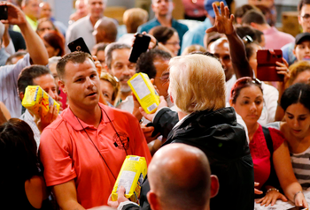 Trump in Puerto Rico: Pictures of Donald Trump throwing paper towel ...