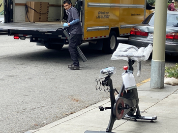 A Peloton indoor exercise bicycle is delivered to a customer during the coronavirus lockdown in San Francisco.