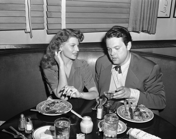 Movie Star Rita Hayworth and actor director Orson Welles, dining at the Hollywood Brown Derby, August 12, 1943, are partners in a Magic Tent Show put on for the Benefit of service men. (AP Photo)