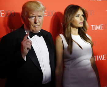 U.S. Republican presidential candidate Donald Trump and his wife Melania pose for photographers on the red carpet as they arrive for the TIME 100 Gala in Manhattan, New York, April 26, 2016.