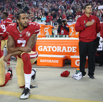 San Francisco 49ers Eric Reid (35) and Colin Kaepernick (7) take a knee during the National Anthem prior to their season opener against the Los Angeles Rams during an NFL football game Monday, Sept. 12, 2016, in Santa Clara, CA. The Niners won 28-0. (Daniel Gluskoter/AP Images for Panini)