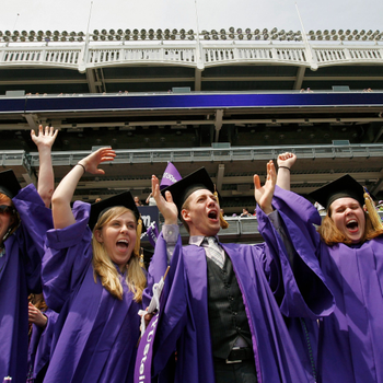 New York University graduates celebrate after having their degrees bestowed upon them.