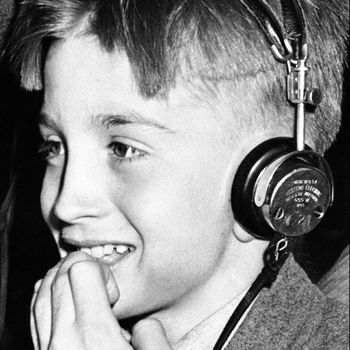 A boy wearing headphones.