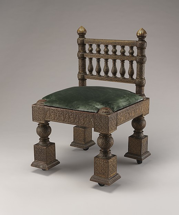 A brass and teak Lockwood de Forest chair made circa 1882-1885.