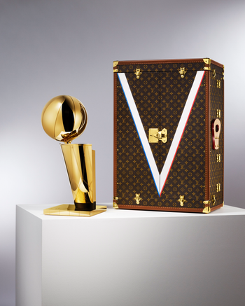 Louis Vuitton&#039;s travel case next to the NBA&#039;s championship trophy