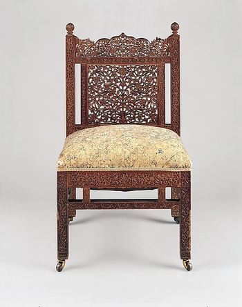 A brass and teak Lockwood de Forest chair made circa 1882-1885.