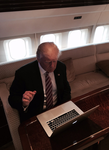 Donald Trump using a computer to answer Reddit questions