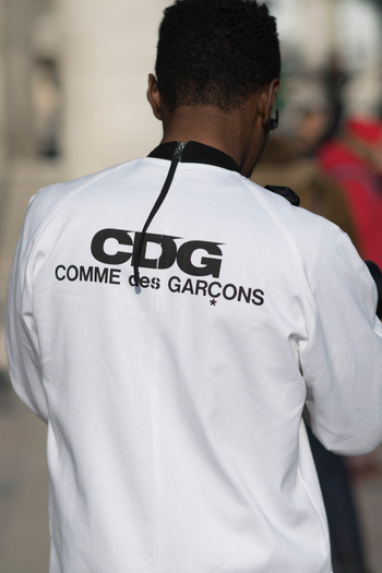 PARIS, FRANCE - JANUARY 20: A guest seen wearing a white jacket from Comme des Garcons in the streets of Paris during the Paris Fashion Week Menswear Fall/Winter 2017/2018 on January 20, 2017 in Paris, France. (Photo by Timur Emek/Getty Images)