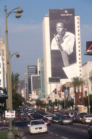 A billboard depicting Miles Davis promotes Apple Computers