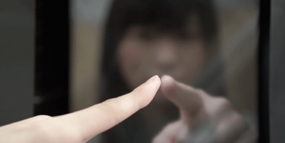 A holographic finger is being touched.