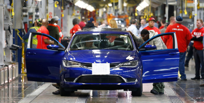 In this March 14, 2014 file photo, a 2015 Chrysler 200 automobile moves down the assembly line at the Sterling Heights Assembly Plant in Sterling Heights, Mich. All automakers report U.S. sales figures for August 2014 on Wednesday, Sept. 3, 2014. Chrysler and Nissan both posted double-digit U.S. sales gains last month, signs of strong August for the industry. (AP Photo/Paul Sancya, File)