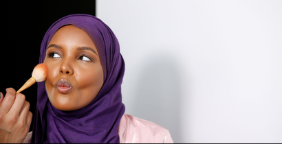 Fashion model and former refugee Halima Aden, who is breaking boundaries as the first hijab wearing model gracing magazine covers and walking in high profile runway shows has her makeup applied during a shoot at a studio in New York City, U.S .August 28, 2017. Photo taken August 28, 2017. REUTERS/Brendan McDermid - RC1F8F423800