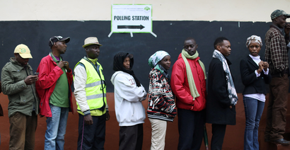 People queue to cast their vote at a polling station during a presidential election re-run in Gatundu, Kenya October 26, 2017.