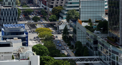 Cars ply the roads in downtown Singapore