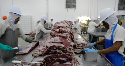 Employees work at the assembly line of jerked beef at a plant of JBS S.A, the world's largest beef producer, in Santana de Parnaiba, Brazil December 19, 2017.