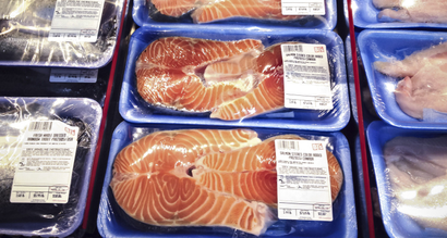 From left, trout, salmon and catfish, are displayed in the seafood section of a discount retailer, often called a "big-box store," Sunday, April 6, 2014, in suburban Virginia, just outside of Washington. (AP Photo/J. Scott Applewhite