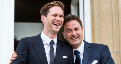 Luxembourg's Prime Minister Xavier Bettel, right, walks out of the town hall with his partner Gauthier Destenay after their marriage in Luxembourg, on Friday, May 15, 2015. The marriage comes one year after the parliament approved legislation to turn Luxembourg into an increasing number of countries allowing for same-sex marriages. Bettel and Destenay have been civil partners since 2010. (AP Photo/Geert Vanden Wijngaert)
