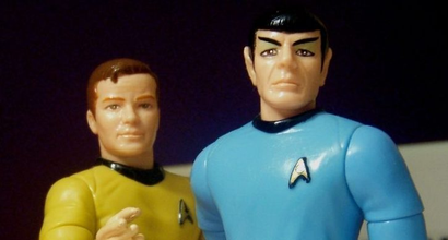 Toy figures of Captain Kirk and Spock from Star Trek, standing next to each other.