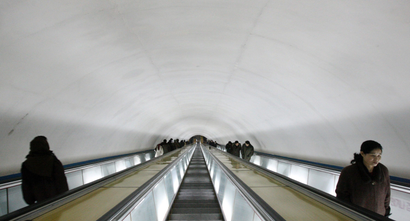 North Korean commuters ride up and down a deep tunnel into a subway station in Pyongyang, North Korea in this Tuesday, Feb. 26, 2008 photo.