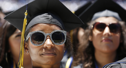 Students listen as U.S. President Barack Obama talks during the commencement ceremony for the University of California, Irvine at Angels Stadium in Anaheim, California June 14, 2014.