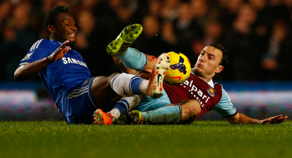 Chelsea's John Obi Mikel (L) challenges West Ham United's Mark Noble during their English Premier League soccer match at Stamford Bridge in London, January 29, 2014. REUTERS/Eddie Keogh (BRITAIN - Tags: SPORT SOCCER) FOR EDITORIAL USE ONLY. NOT FOR SALE FOR MARKETING OR ADVERTISING CAMPAIGNS. NO USE WITH UNAUTHORIZED AUDIO, VIDEO, DATA, FIXTURE LISTS, CLUB/LEAGUE LOGOS OR "LIVE" SERVICES. ONLINE IN-MATCH USE LIMITED TO 45 IMAGES, NO VIDEO EMULATION. NO USE IN BETTING, GAMES OR SINGLE CLUB/LEAGUE/PLAYER PUBLICATIONS - RTX18088