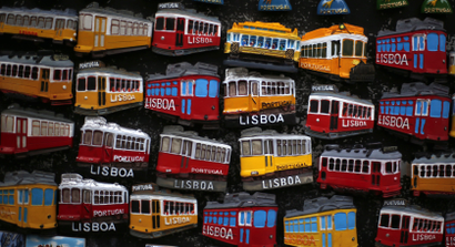Magnets designed like trams are seen at a souvenir shop in downtown Lisbon