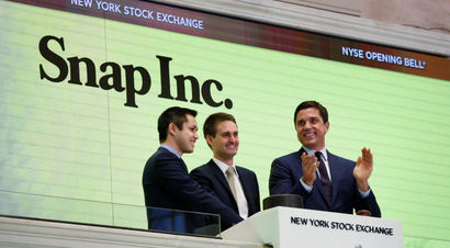 Snap cofounders Evan Spiegel (C) and Bobby Murphy ring the opening bell of the New York Stock Exchange (NYSE) with NYSE Group President Thomas Farley shortly before the company's IPO in New York, U.S., March 2, 2017. REUTERS/Lucas Jackson TPX IMAGES OF THE DAY - RC15379A9A10