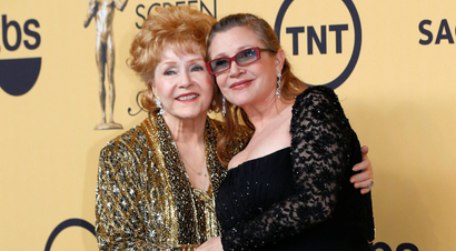 Actress Debbie Reynolds poses with her daughter actress Carrie Fisher