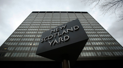 A sign is seen outside New Scotland Yard in central London January 10, 2014. Metropolitan Police Commissioner Bernard Hogan-Howe has apologised to former cabinet minister Andrew Mitchell, after police officer Keith Wallis admitted to misconduct in a public office. Wallis claimed to have witnessed a row between former cabinet minister Andrew Mitchell, and police officers manning the gates of Downing Street, local media reported. REUTERS/Luke MacGregor (BRITAIN - Tags: CRIME LAW POLITICS) - RTX178Q5