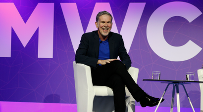 Netflix's CEO Hastings reacts as he delivers his keynote speech during Mobile World Congress in Barcelona