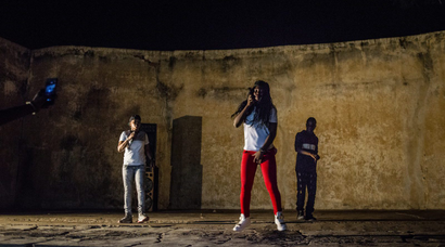 Little Ami (center) takes the stage with Ami (left) during one of her last songs of the evening on May 20, 2017 in Macina, Mali.