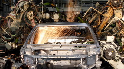 Robots weld the bodyshell of a Toyota Camry Hybrid car
