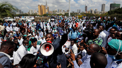 Ouma Oluga, Secretary-General of the Kenya Medical Practitioners, Pharmacists and Dentist Union (KMPDU), addresses doctors during a strike to demand fulfilment of a 2013 agreement between their union and the government that would raise their pay and improve working conditions outside Ministry of Health headquarters in Nairobi, Kenya December 5, 2016.