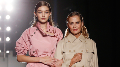 Models Gigi Hadid (L) and Lauren Hutton present creations at the Bottega Veneta Spring/Summer 2017 show in Milan, Italy.