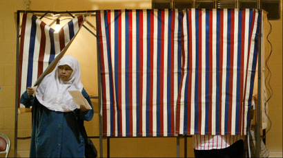 muslim woman leaving voting booth